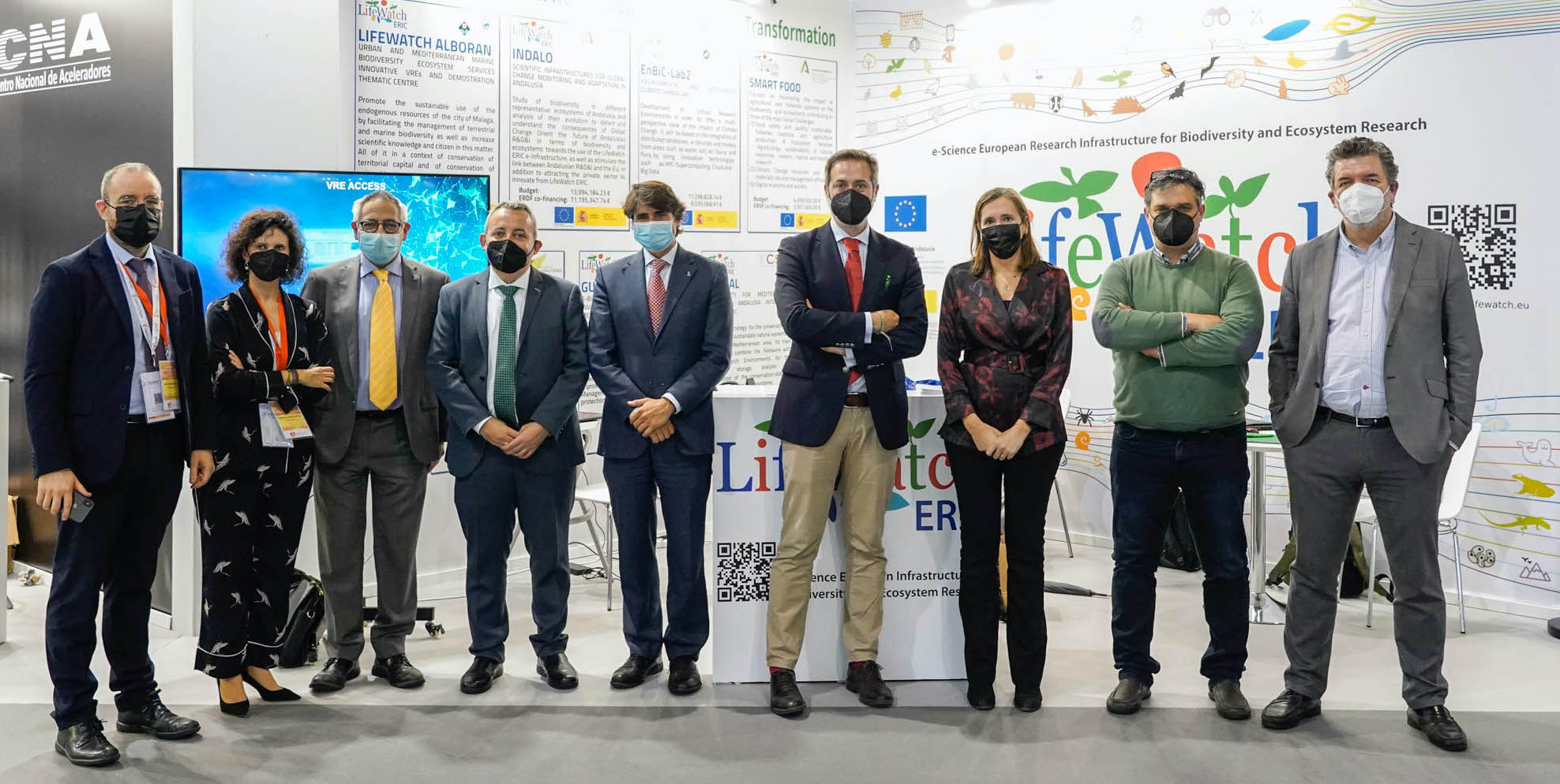 LifeWatch colleagues pose for a photo wearing masks at Transfiere Forum
